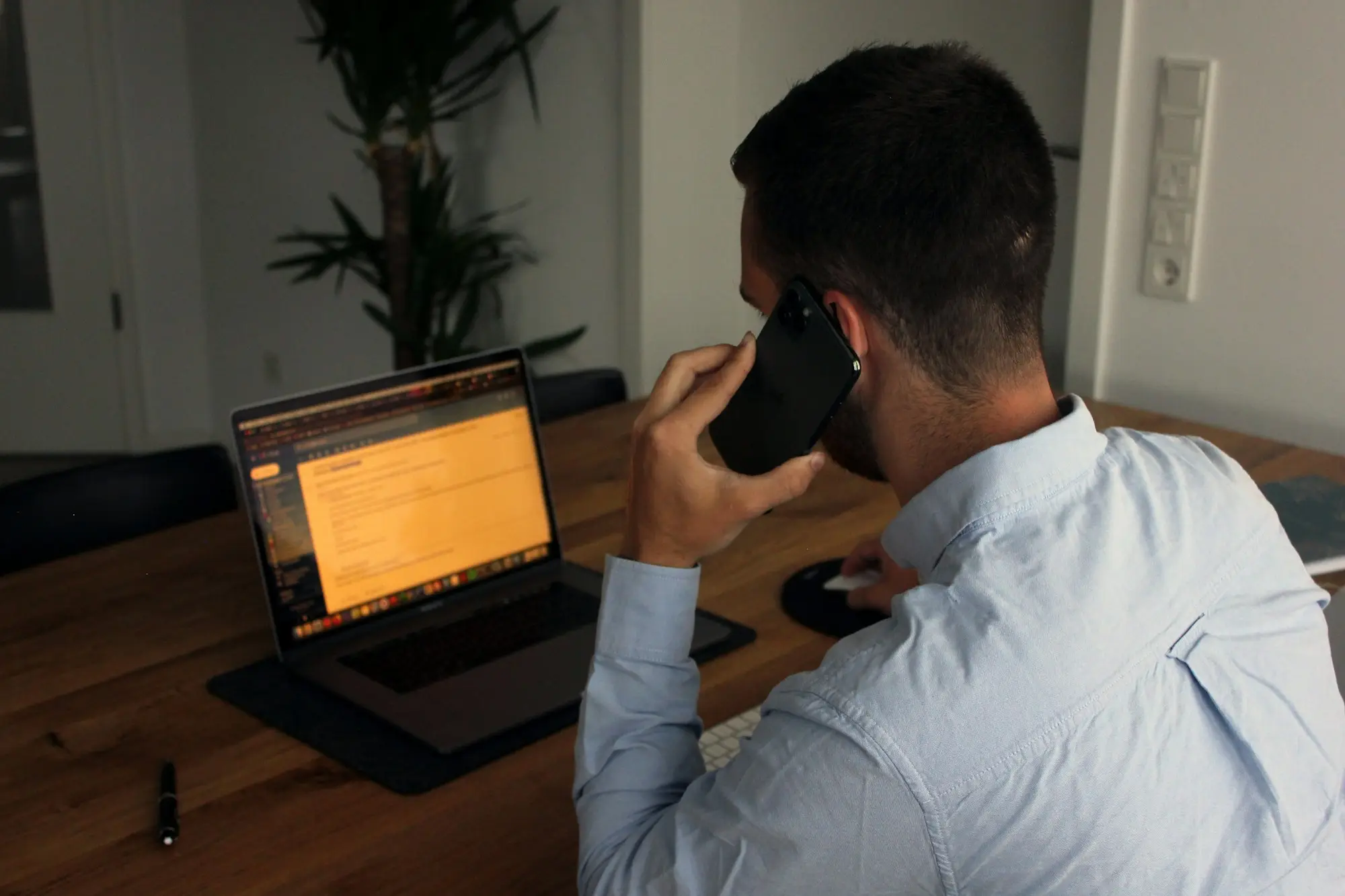 Business owner on a phone call at his desk